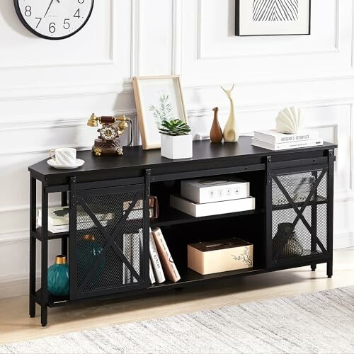Modern console table with decor items and storage shelves.