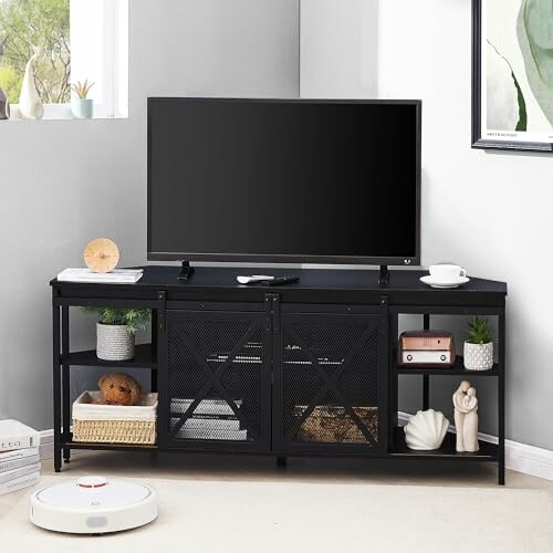 Modern living room with TV on black stand, shelves, and decor.